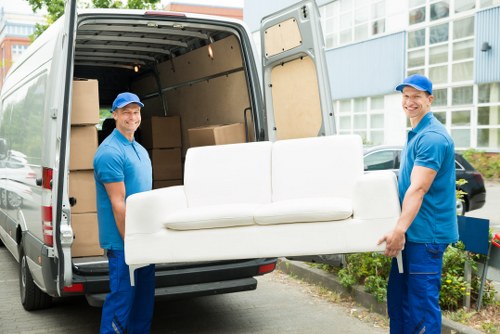 Removal van and moving boxes in Barnes residential street