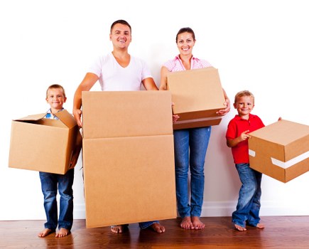 Removal team handling boxes and furniture in Barnes
