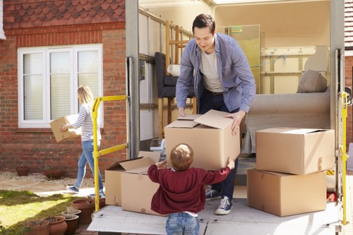 Professional same day removals team loading a van in Barnes