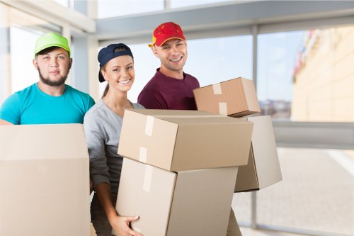 Professional movers in Barnes packing household items securely for relocation