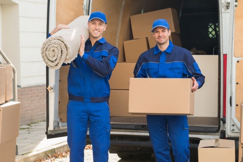 Man with van in Barnes loading boxes for a local move