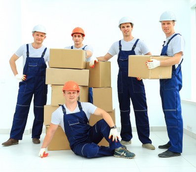 Professional removals planning in Barnes with moving van and packed boxes