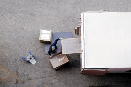 Professional movers handling office equipment for commercial removals in Barnes