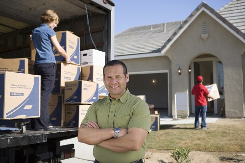 Careful loading of furniture into a moving truck in Barnes