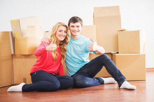 Professional movers packing furniture for a Barnes relocation
